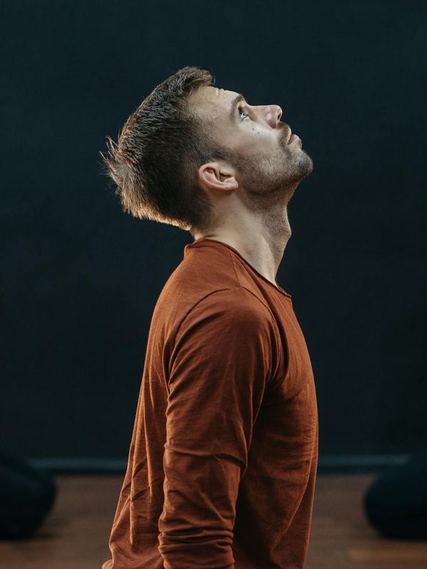 Person in a balancing yoga posture showing focus and stability.